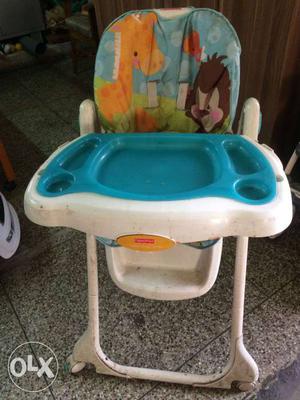 Baby's White, Teal, Green, And Orange Feeding Chair