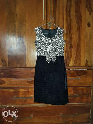Black and white, single piece party dress. Age
