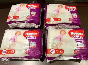 Four Huggies Pants Plastic Packs