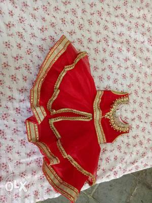 Red net material with golden work. party and