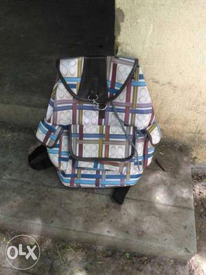 White, Red, Blue, And Black Coach Monogram Backpack