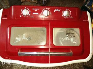 4 years old godrej white and red semi-automatic washing