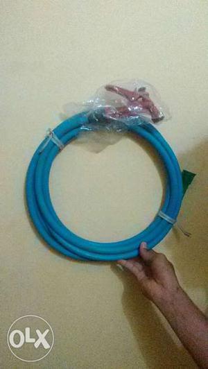 Blue Garden Hose With Red Nozzle