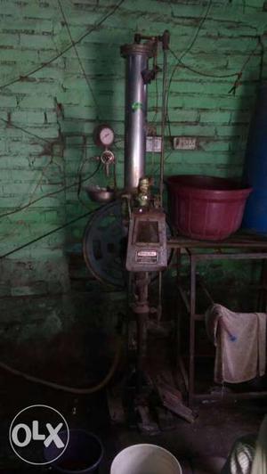 Gray And Brown Rusty Corded Pump Machine