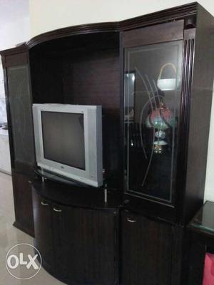 Silver CRT TV And Black Wooden TV Hutch