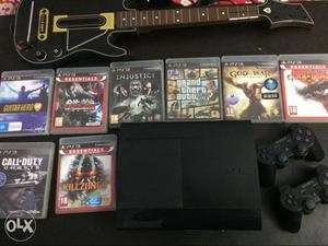 Sony ps3 1 year with games and guitar controller