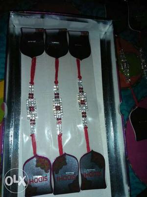 Beautiful collection of 3 Red And Crystal rakhis