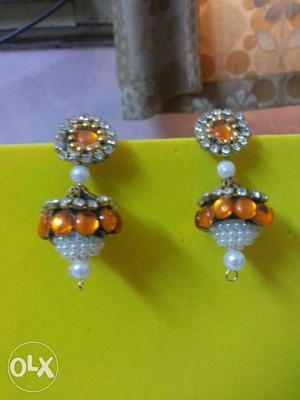 Beautifully handcrafted Orange earrings combined with moti