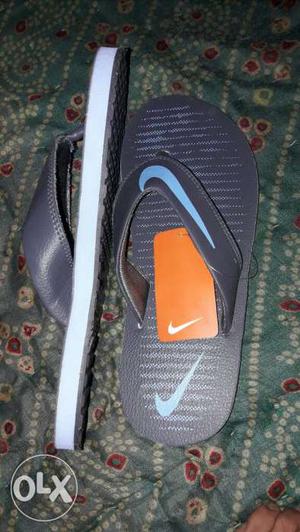 Black-and-blue Nike Swoosh Flip-flops