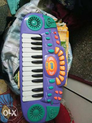 Children's Purple And White Plastic Piano Toy