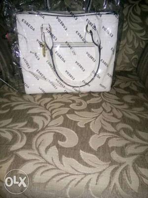 Esbeda handbag, white in colour. unused. branded