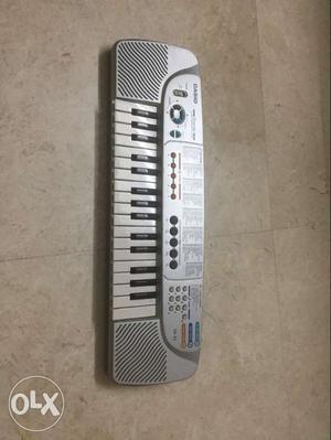 Grey And White Casio Electric Keyboard SA45