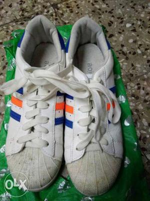 Pair Of White, Blue And Orange Low Top Sneakers