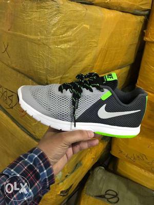 Paired Black, Gray, And Green Nike Low-top Sneaker