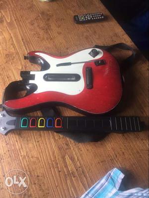 Red, Black, And White Guitar Hero Controllero