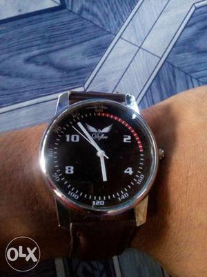 Round Silver Case With Black Leather Strap Watch