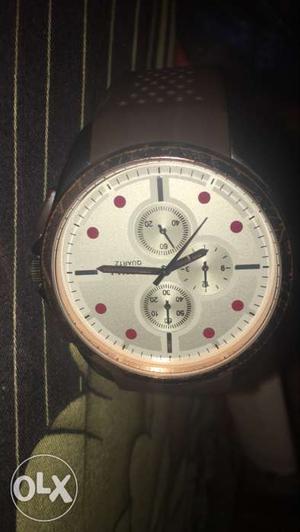 Round Silver Chronograph Watch With Brown Rubber Strap