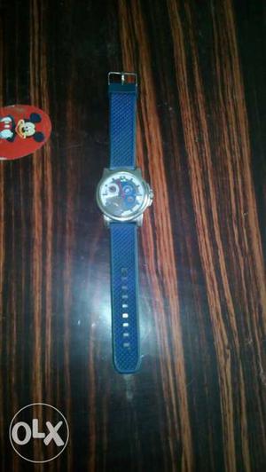 Round Silver Framed Chronograph Watch With Blue Strap