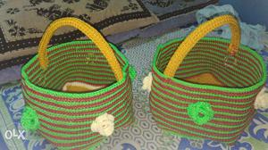 Two Green, Yellow, And Brown Crochet Basket