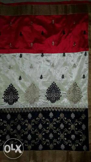 White, Black, And Red Textile
