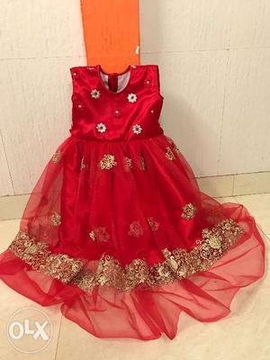 A new beautiful and elegant home made red gown