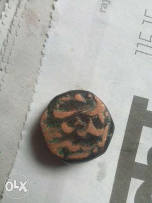 Brown And Black Ancient Coin