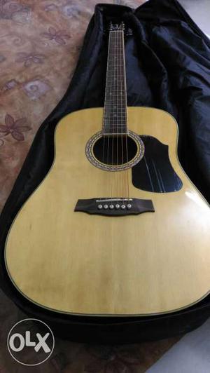Brown And Black Wooden Acoustic Guitar