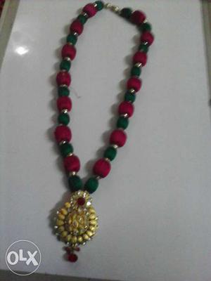Brown, Green, And Red Beaded Necklace