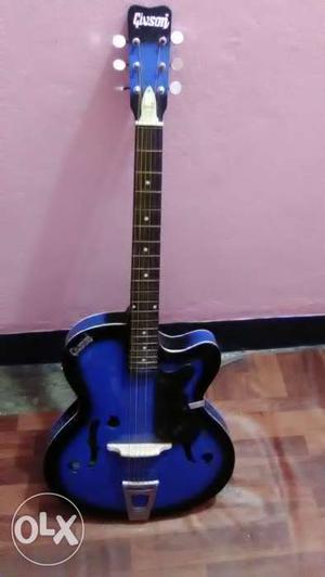Givson blue and black six string guitar