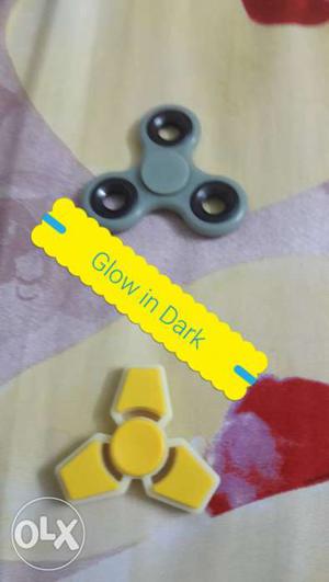 One Gray And One Yellow Hand Spinners
