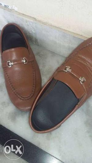Pair Of Brown Leather Penny Loafers