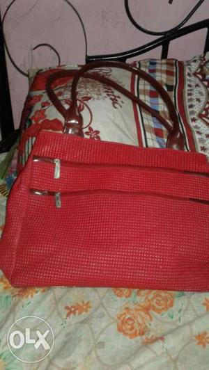 Red ladies bag. 1 month old. it has 2 big