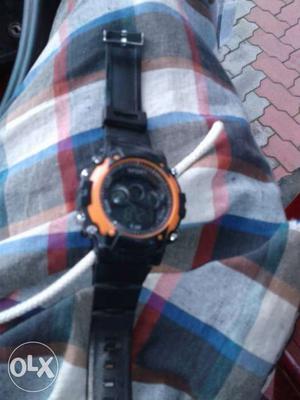 Round Black And Orange Chronograph Watch With Black Sports