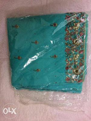 Teal And Brown Textile In Pack