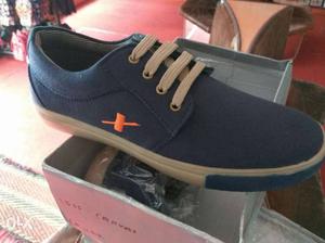 Unpaired Blue Low Top Sneakers