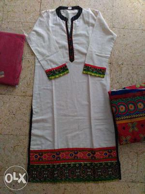 White, Black, Green, And Red Traditional Dress