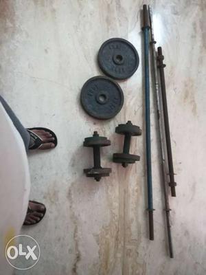 Black Barbell Bars And Weighing Plates