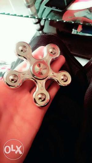 Brand new fidget spinner. Silver in colour. Spin