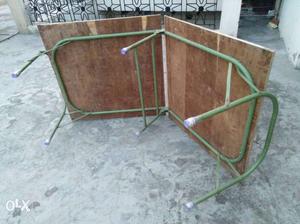 Green Metal-framed Brown Board Top Bed