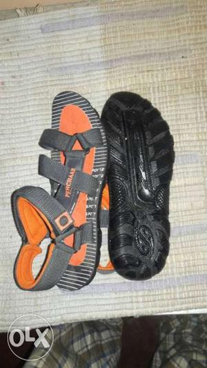 Pair Of Grey-and-orange Walking Sandals