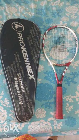 Tennis racket with cover..used only once..in