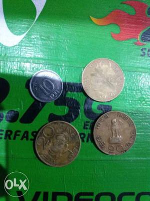 Three Copper And One Silver Round Coins