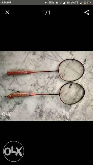 Two Red And Brown Badminton Rackets Screenshot