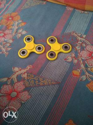 Two Yellow Hand Spinners.