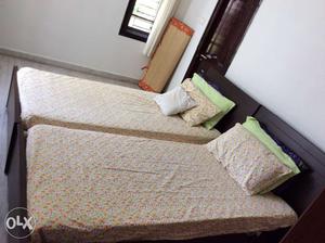 2 single, both sides storage teak wood cots with