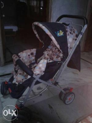 Black And Brown Polka Dotted Stroller