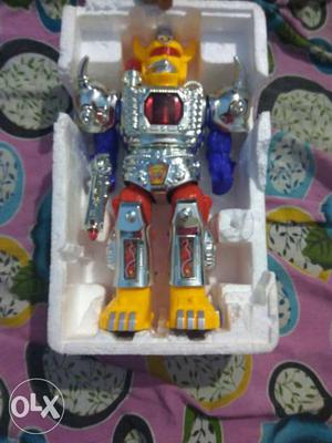 Gray, Blue And Yellow Robot Figure With Box