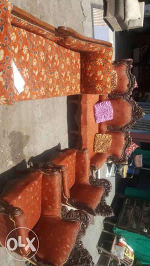 Orange Floral Print Couch And Two Armchairs