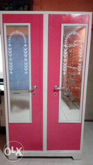 Pink And White Metal Locker With Mirror