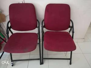 Two Red Steel Folding Chairs